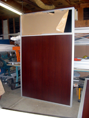 office panel with wood grain laminate surface and tinted window